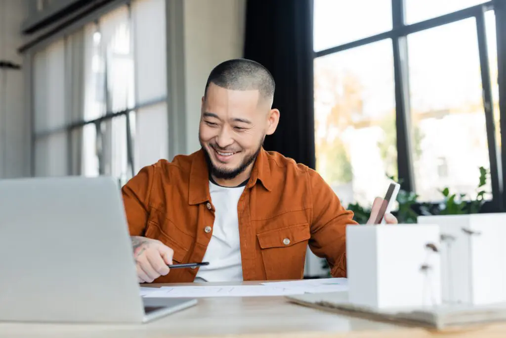 smiling asian man speaking to QuickMD Doctor