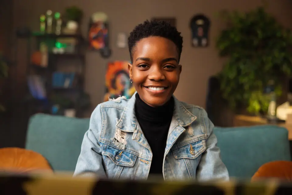 African American woman smiling at her computer