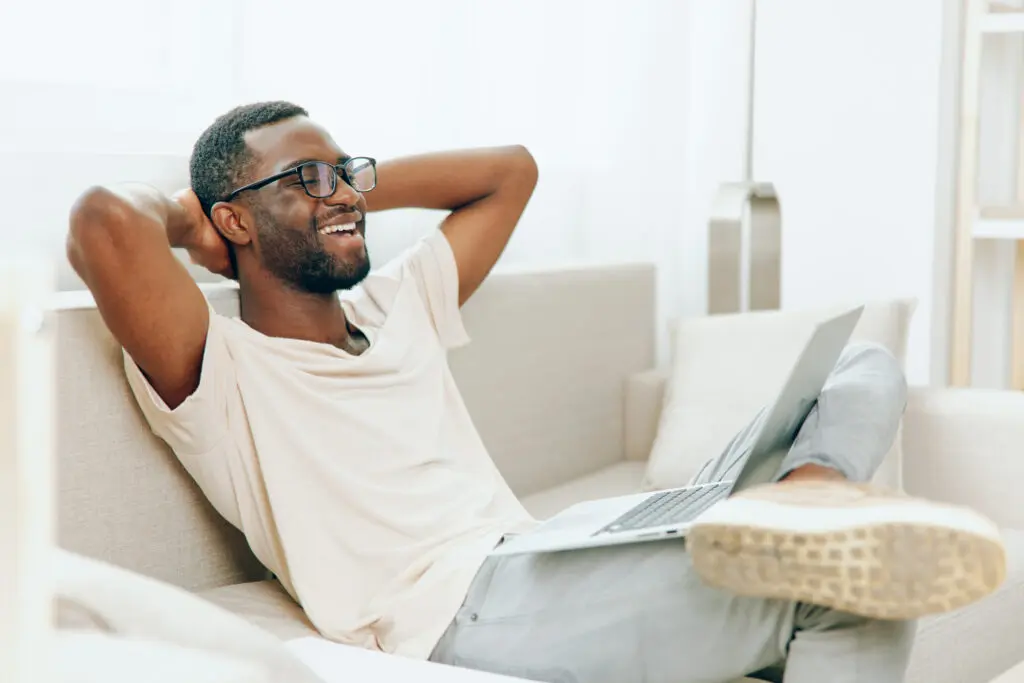 Smiling African American Man on video call for telehealth services