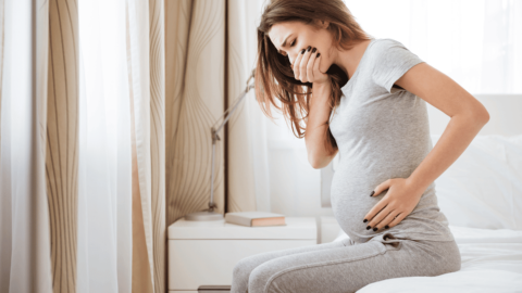 Woman experiencing nausea from hyperemesis gravidarum|Woman struggling with treating IBS