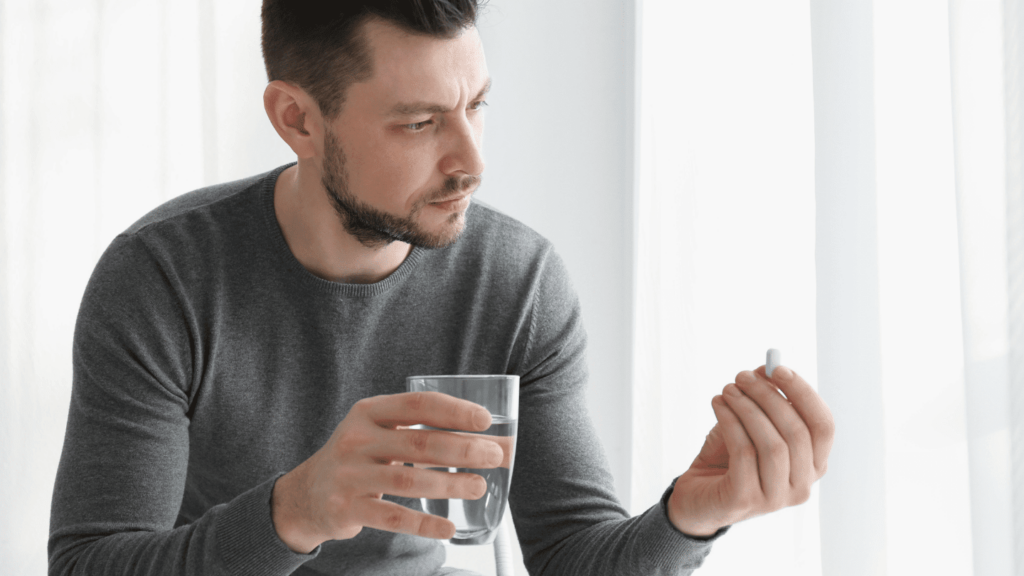 Man taking a Zubsolv pill