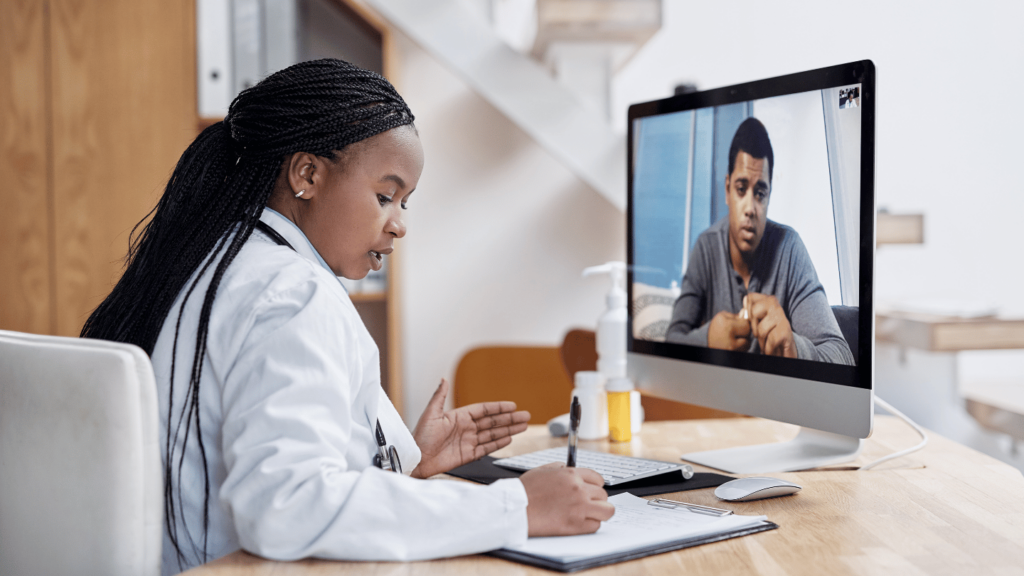 QuickMD doctor meeting with a patient to write a doctor's note via telehealth|