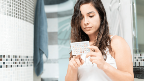 Woman examining birth control options