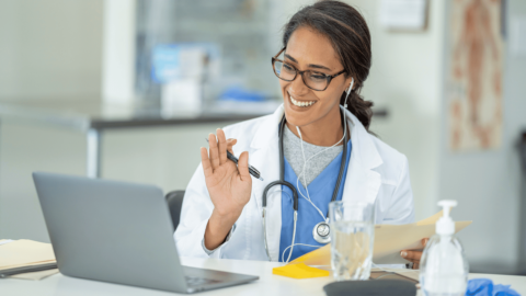 Smiling doctor conducting an online consultation with a patient explaining how Wegovy works for weight loss