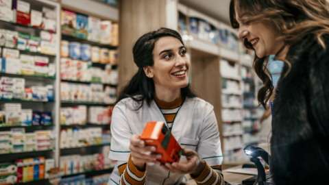 Pharmacist discussing the cost of semaglutide medication options with a customer