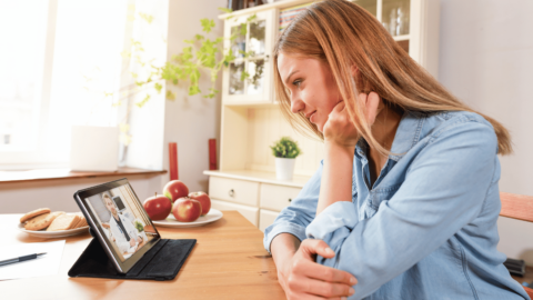 Patient having a telehealth consultation with a doctor via tablet for online Suboxone clinic treatment