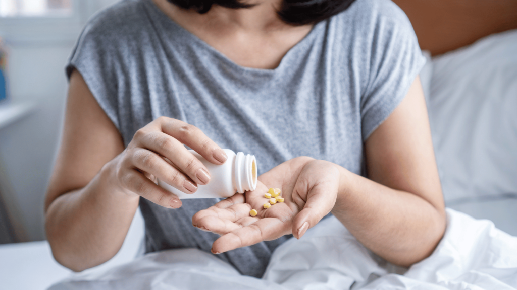 Woman emptying Suboxone tablets into her hand