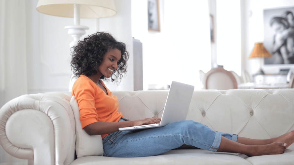 Woman on a couch buying Ozempic online with QuickMD