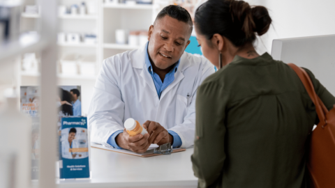 Pharmacist helping a woman fill a Suboxone prescription without insurance