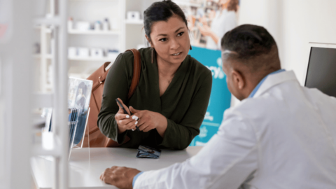 Woman asking a pharmacist about the Ozempic shortage and where to get it