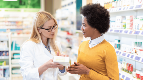 Pharmacist explaining the Wegovy shortage to a woman