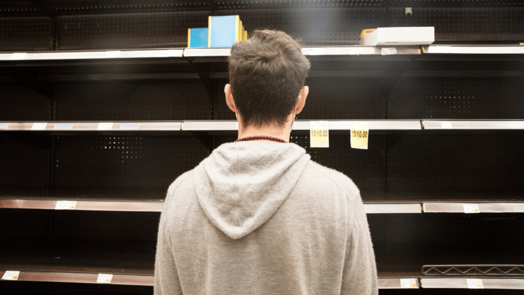 Man standing in front of shelves that are out of stock Wegovy