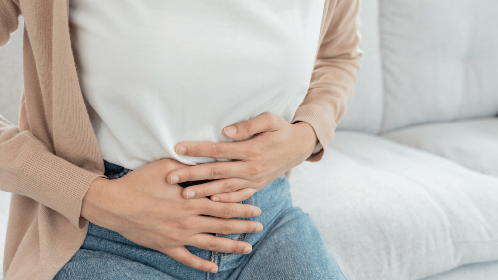 Woman experiencing pain from Ozempic diarrhea