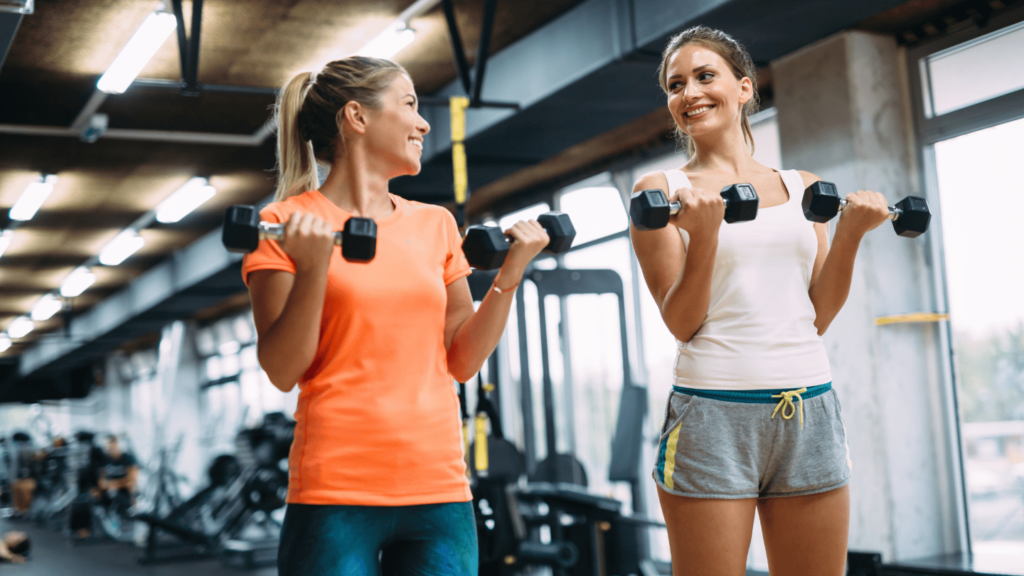 Two women working out in the gym