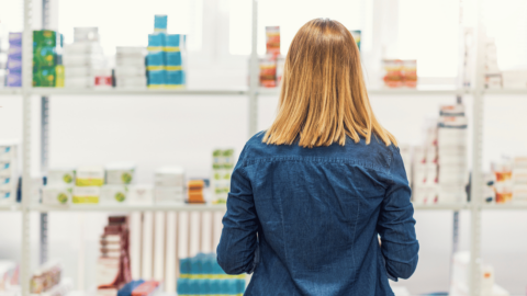 Woman looking at shelves representing Liraglutide prices increasing