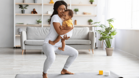 Woman working out with her baby