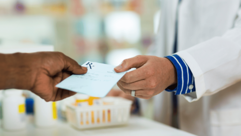 Person handing pharmacist an prescription for a Mounjaro alternative