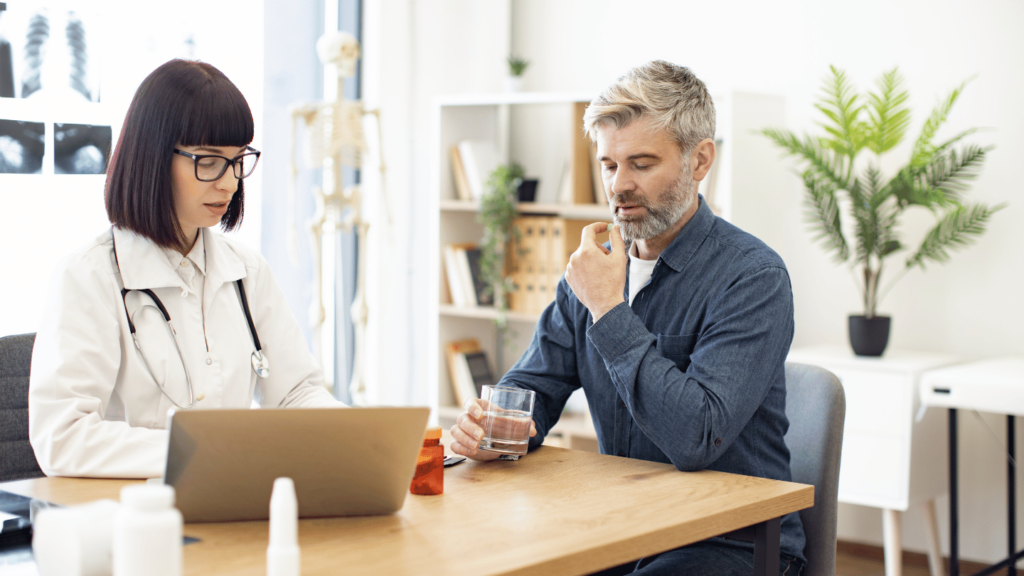 Man taking Suboxone in front of doctor