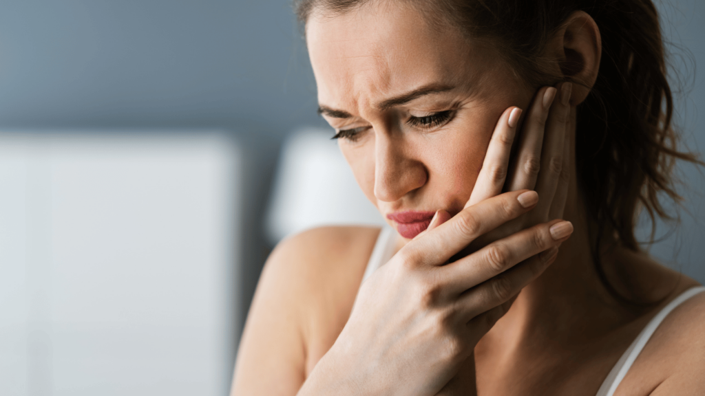 Woman experiencing tooth pain from Suboxone tooth decay