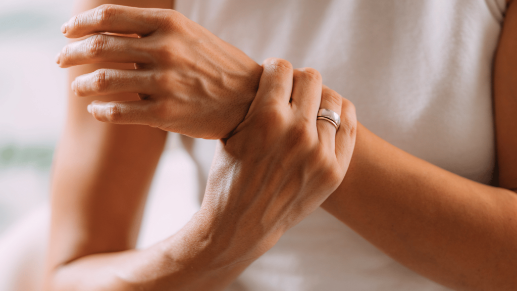 Woman grasping wrist in need of suboxone for pain management