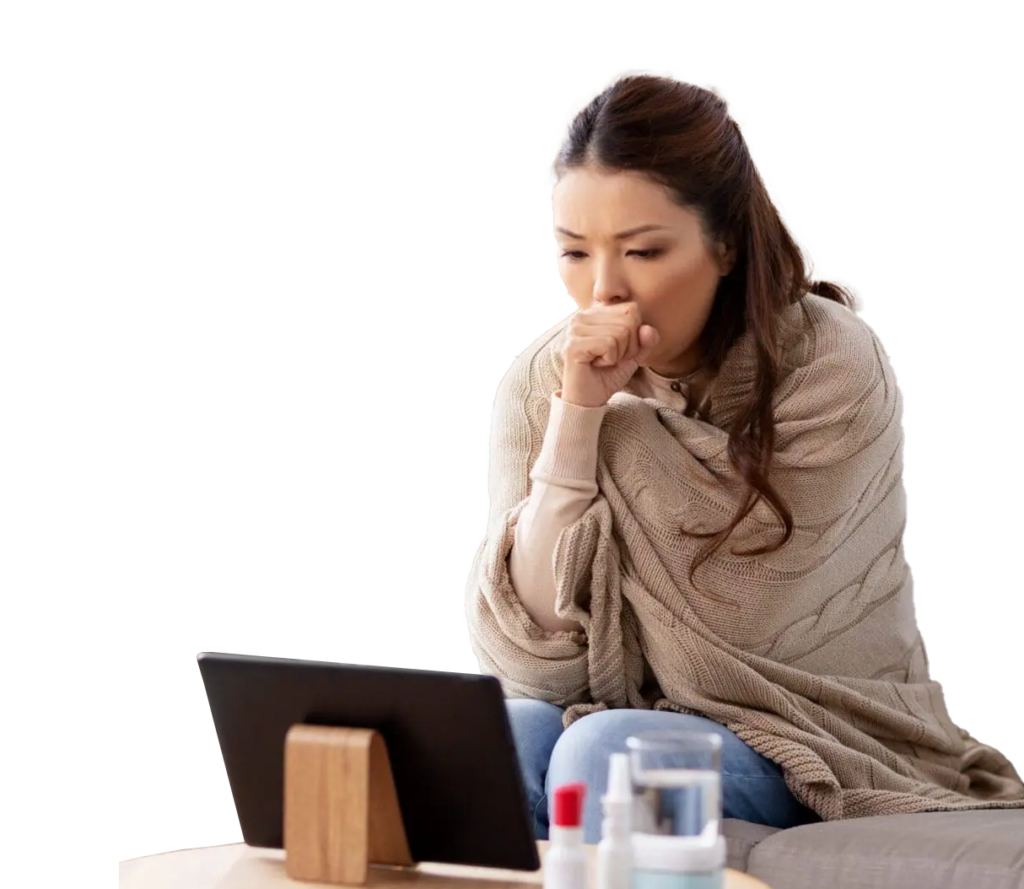 sick woman wrapped in blanket on a QuickMD telehealth urgent care call