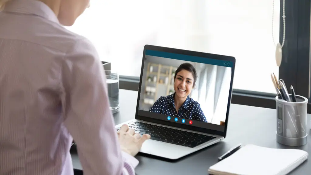 woman sitting on QuickMD telehealth call