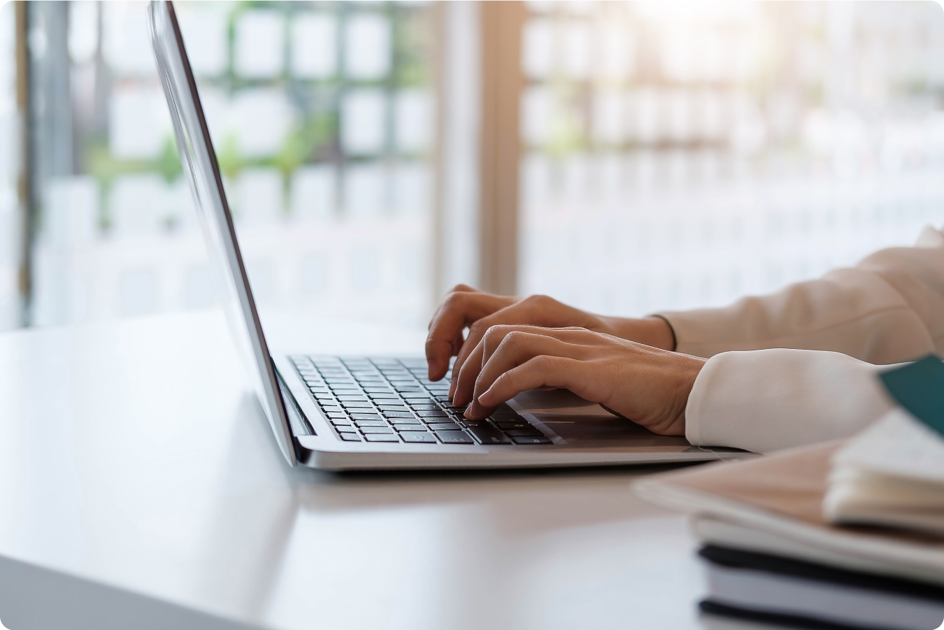 woman hands on a laptop keyboard