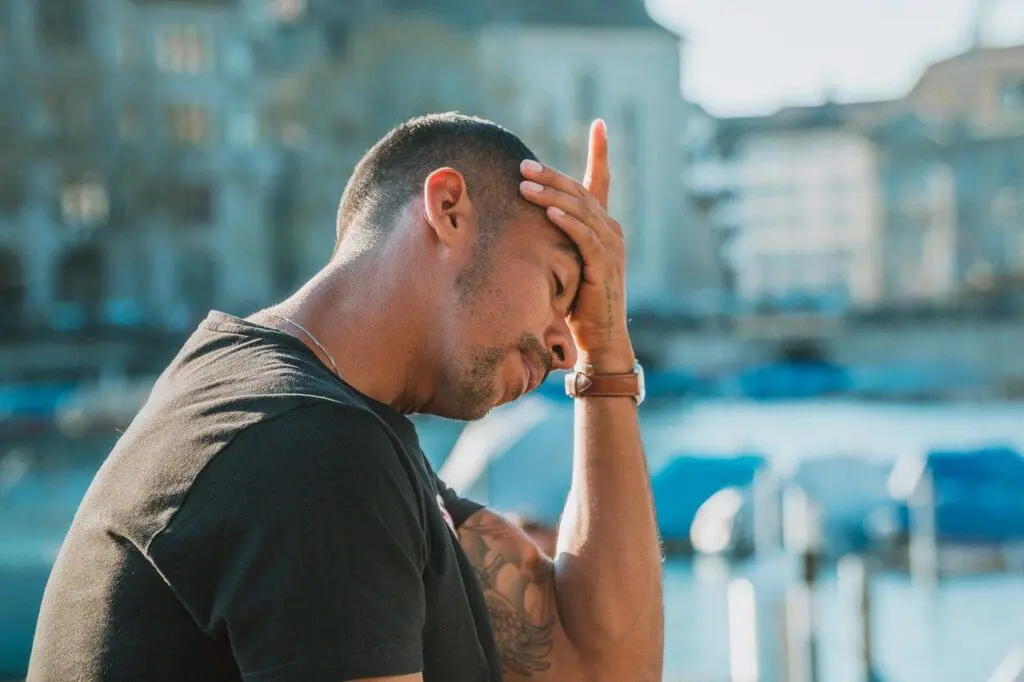 Man experiencing different types of headaches