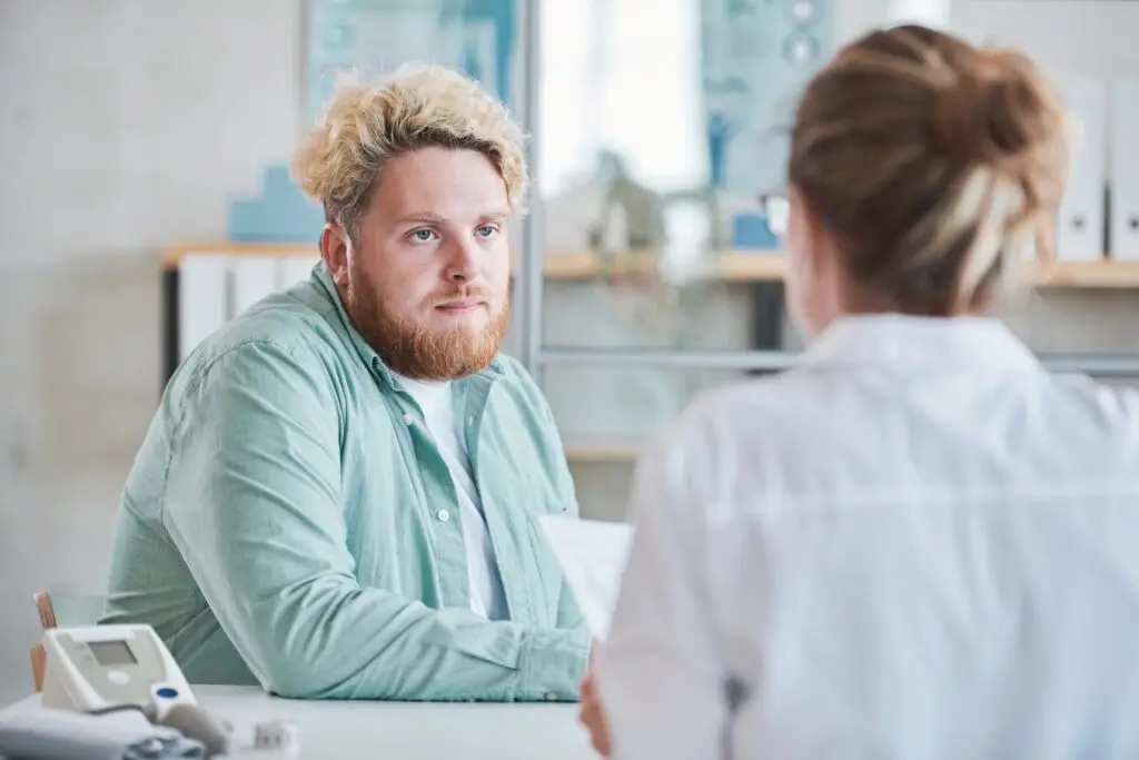 Man meeting with QuickMD doctor to discuss weight stigma