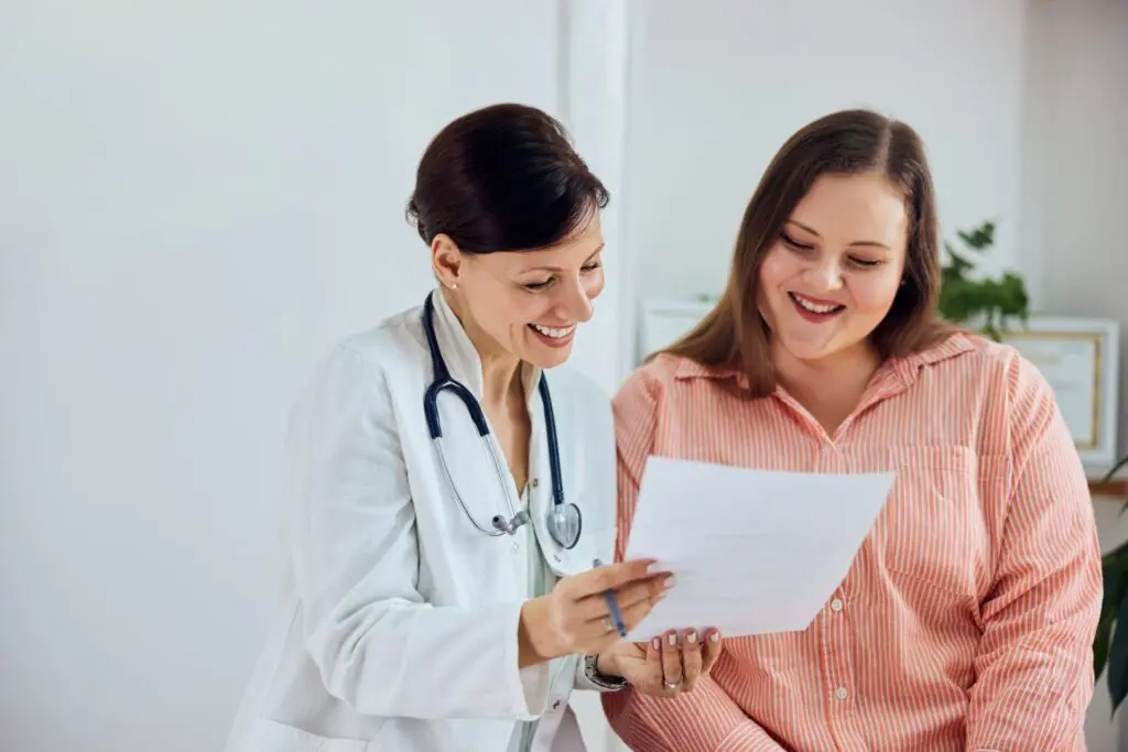 Woman consulting with a weight loss provider at QuickMD about Victoza (liraglutide)|A telemedicine doctor at QuickMD describing Victoza for Weight Loss