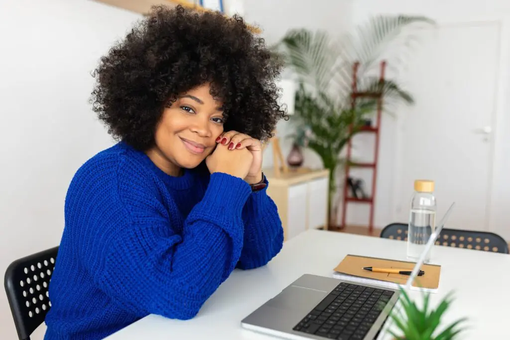 Woman smiling after using telehealth healthcare services