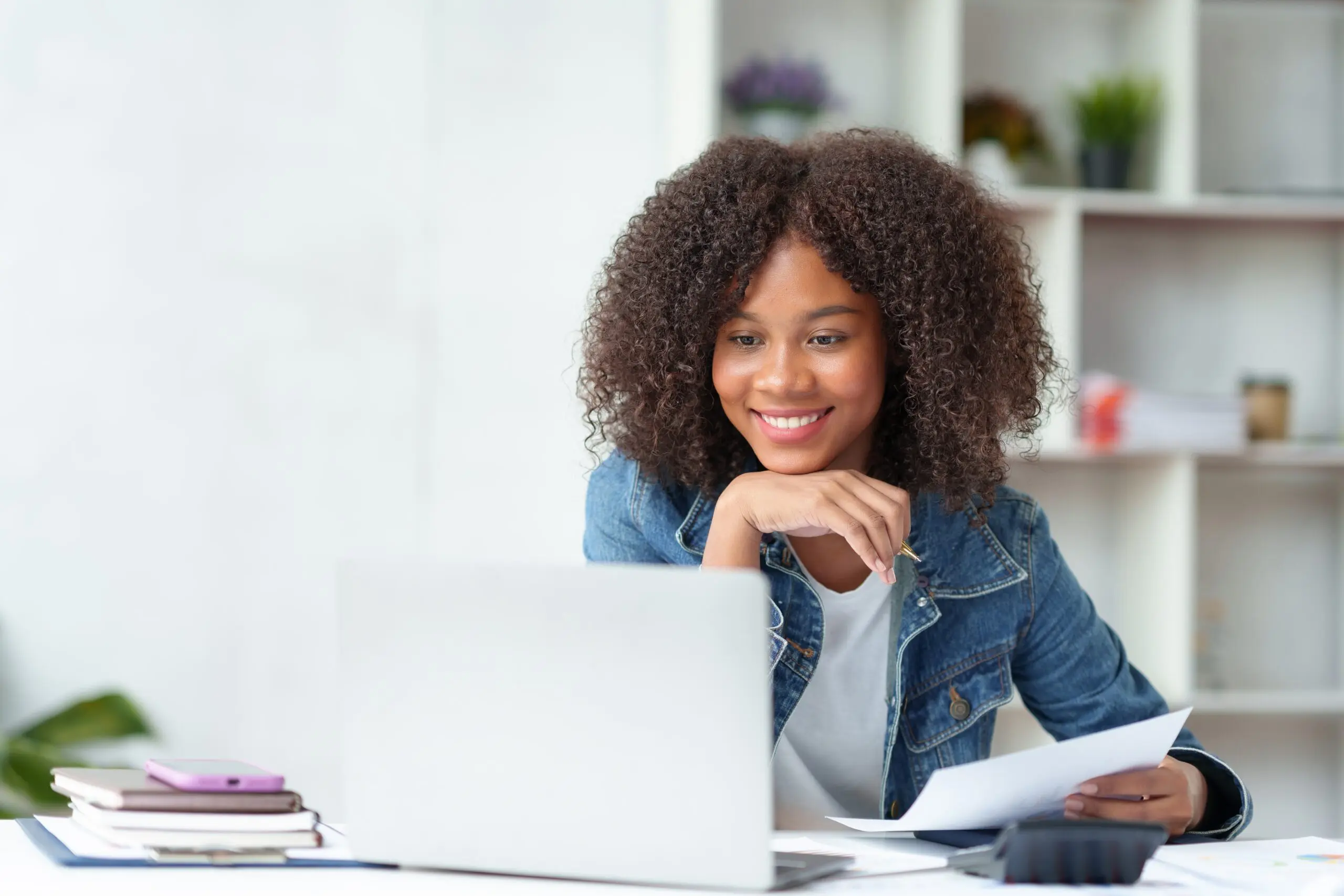 Happy african american woman smiling while on a telehealth call