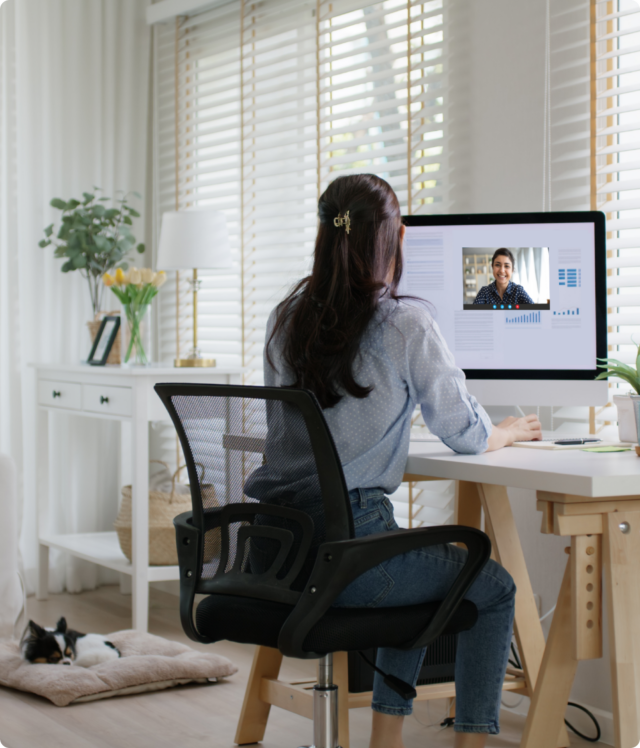 Woman sitting on her computer doing a telehealth session