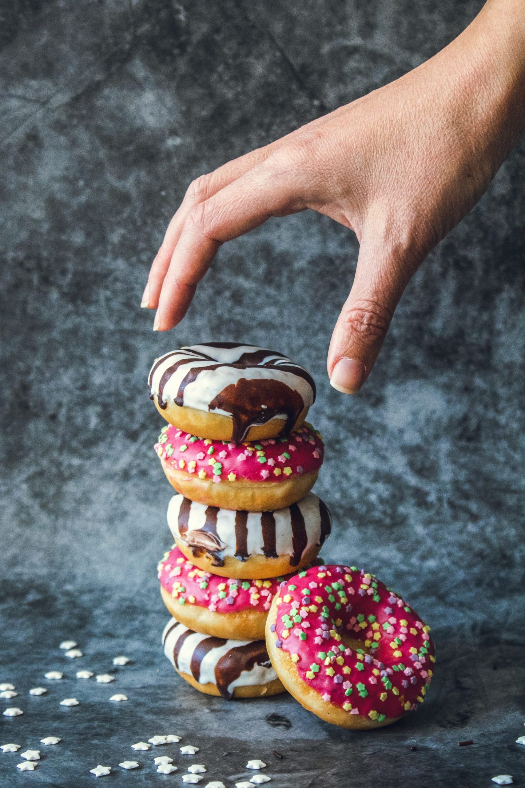 Stack of donuts containing processed sugar which can cause acne in some